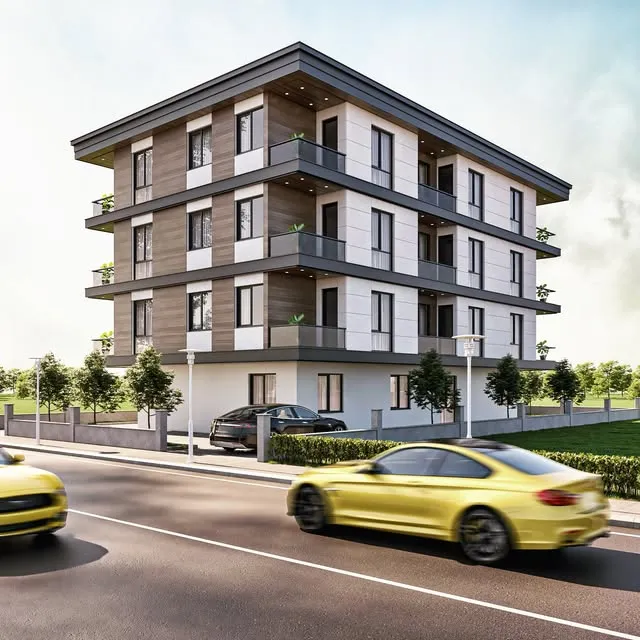 Gri cepheli dört katlı apartman, önünde cadde